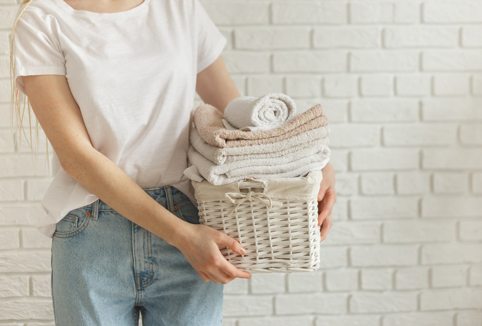 Woman Holding a Laundry Basket